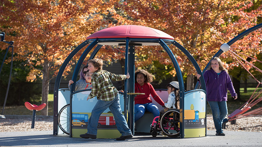 Kids playing on the We Go Round image